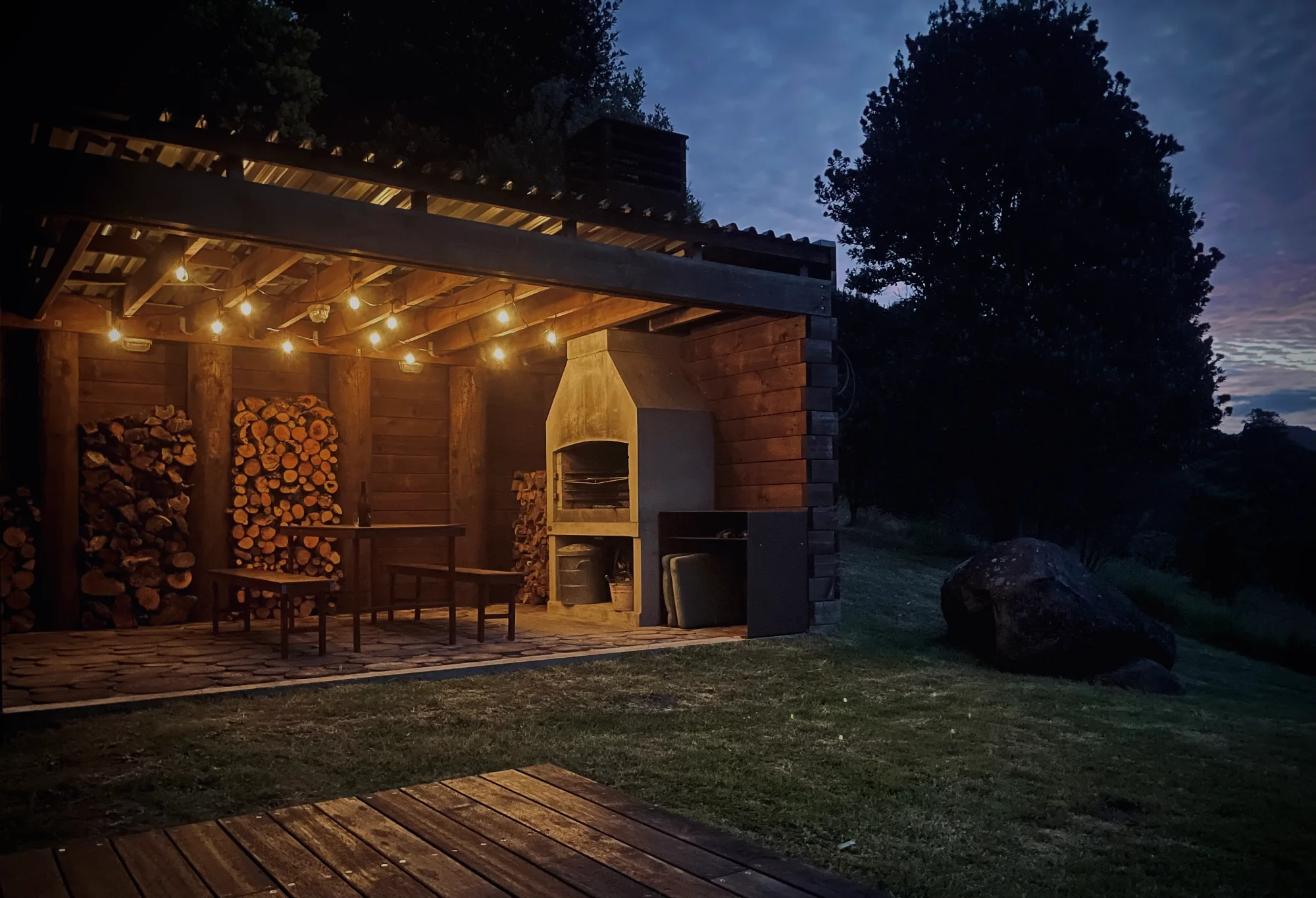 Iron-Clad House - outdoor dining at dusk